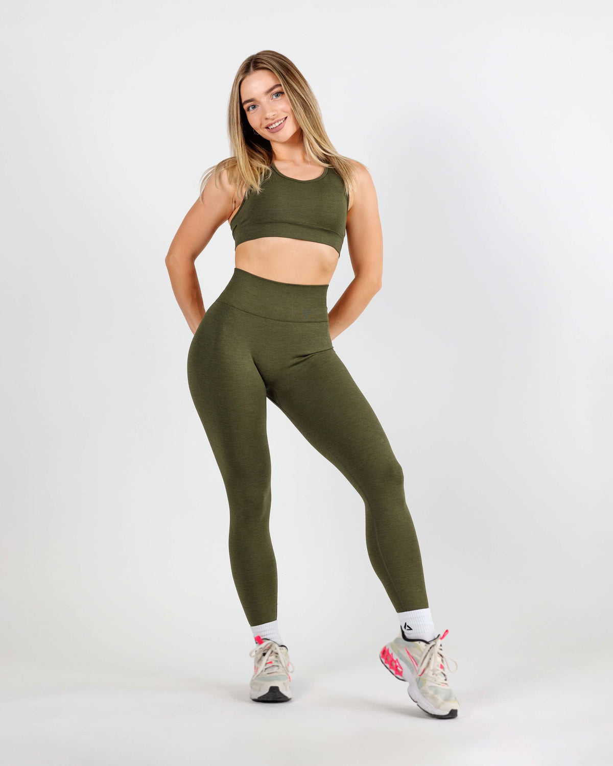 Full body rear view of the Curve Scrunch Butt Leggings emphasizing the flattering silhouette and earthy army green tone.