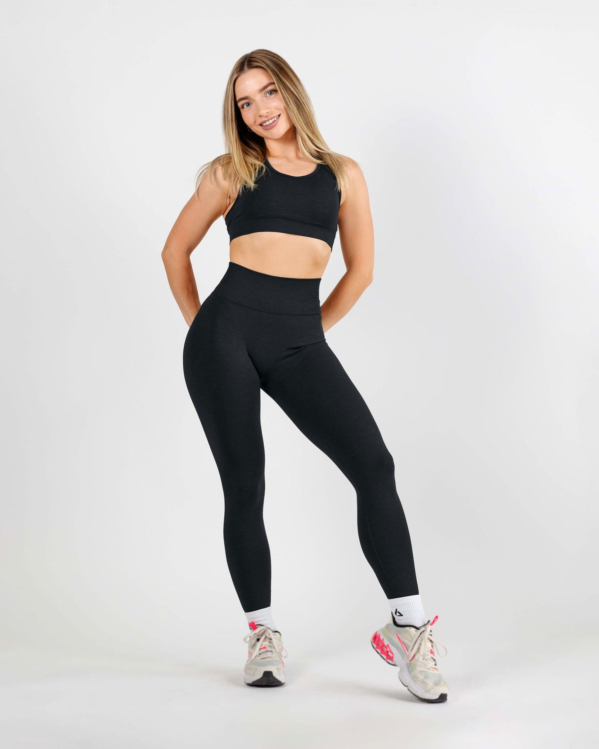 Full body rear view of the Curve Scrunch Butt Leggings emphasizing the high waistband that smooths and supports the core.