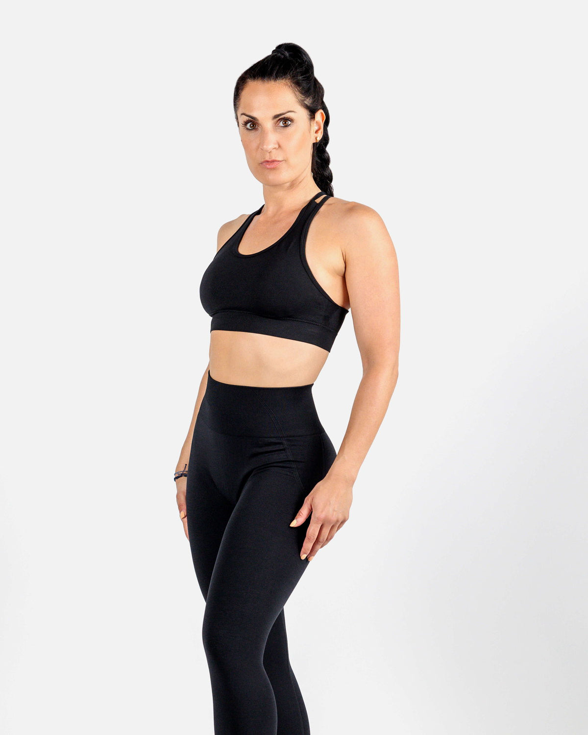 High-impact black sports bra in moisture-wicking stretch fabric for workouts.