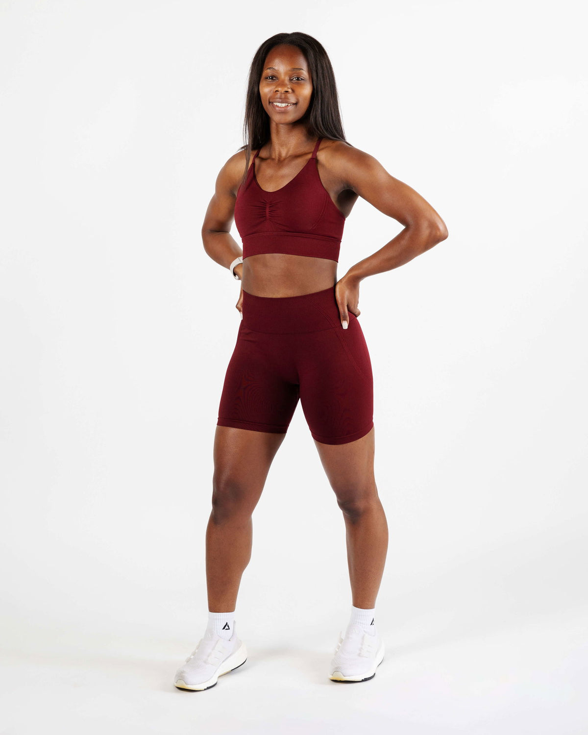 Model wearing the Red High Support Sports Bra and shorts set, built for high-intensity training with exceptional support and breathability