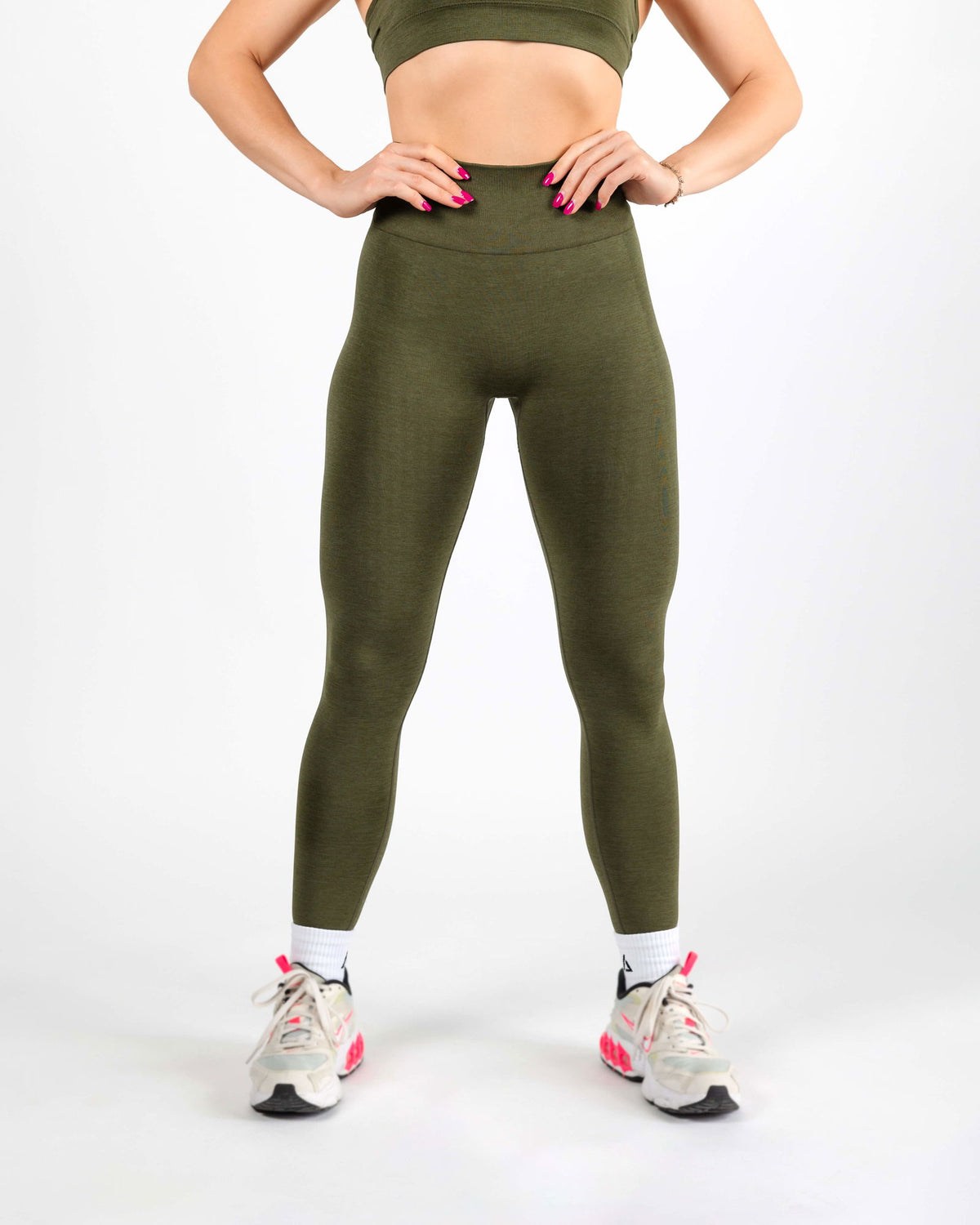 High-waisted Army Green Leggings with seamless construction providing secure core support and an elevated aesthetic.