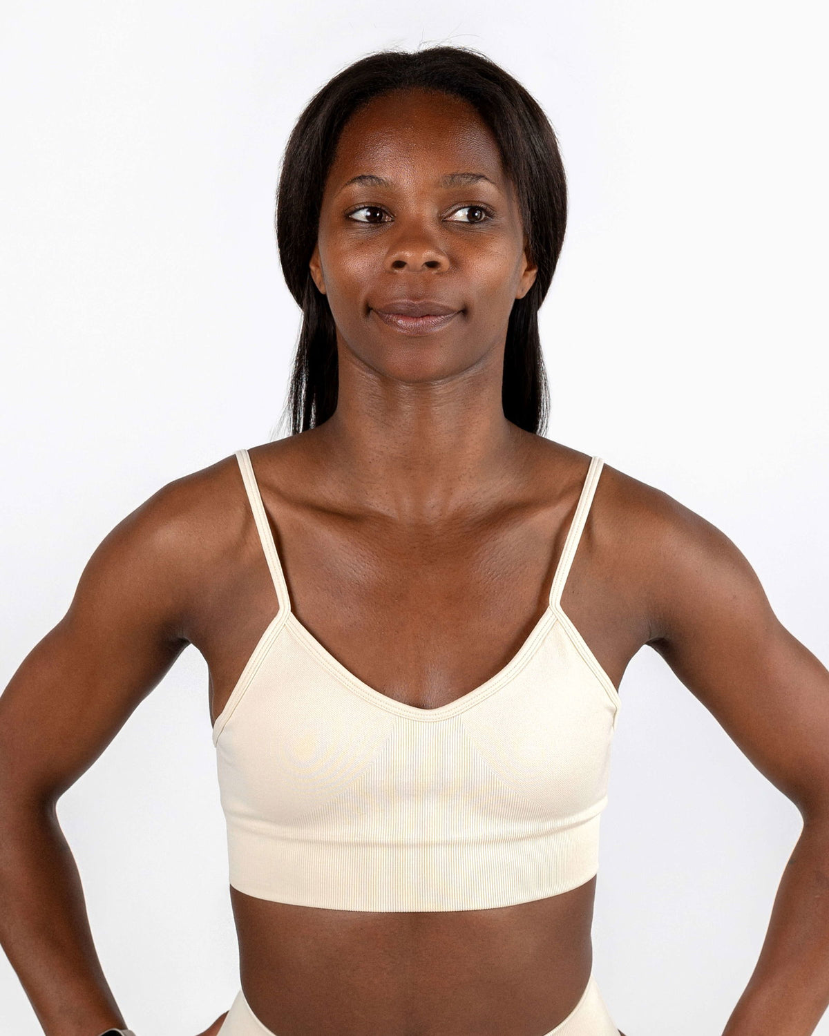Ivory Motion Bra with lightweight support and sculpted fit. Shows soft, breathable, 4-way stretch fabric and scoop neckline.