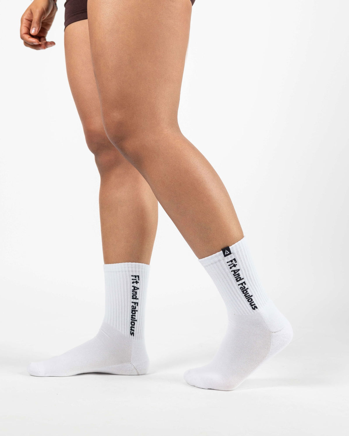 Back angle of white crew socks highlighting comfortable ankle support.